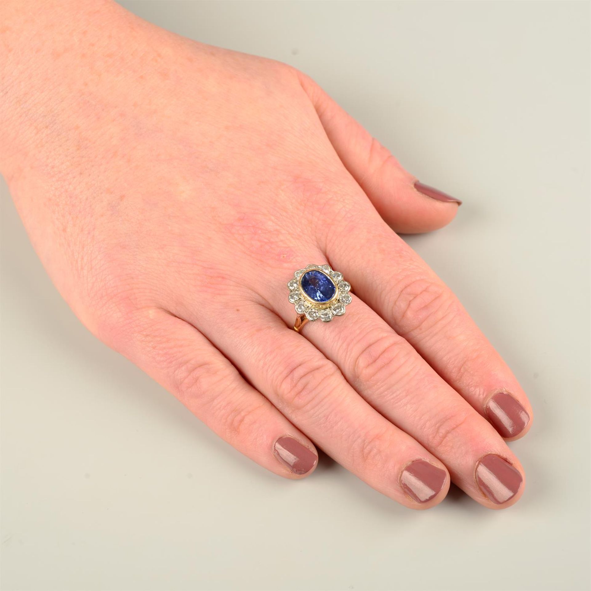 An 18ct gold sapphire and brilliant-cut diamond cluster ring. - Image 5 of 5