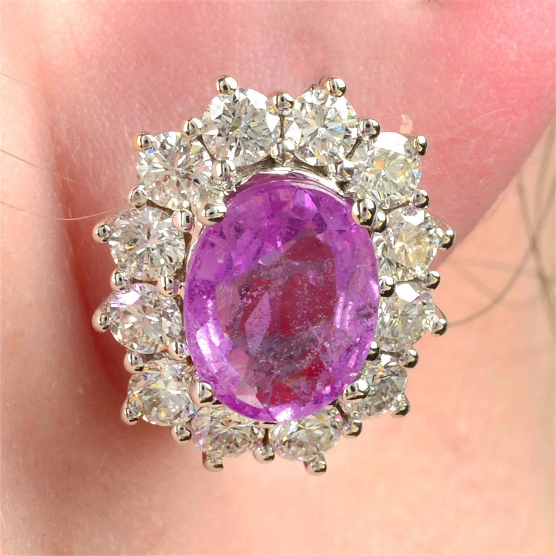 A pair of 18ct gold pink sapphire and brilliant-cut diamond cluster stud earrings.