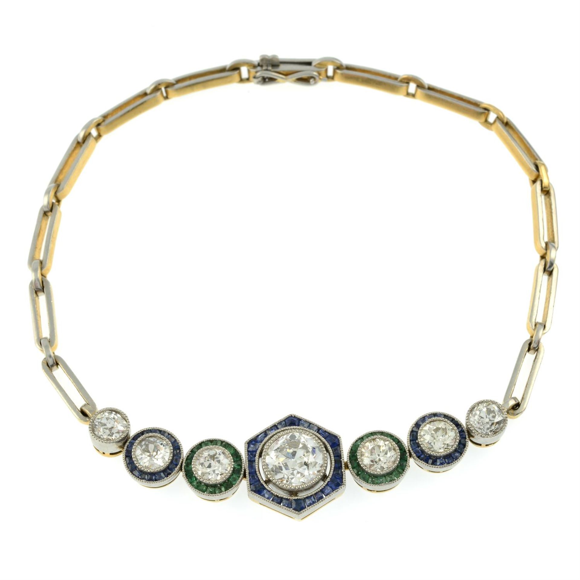 An old-cut diamond bracelet, with calibre-cut sapphire and emerald surrounds. - Image 2 of 4