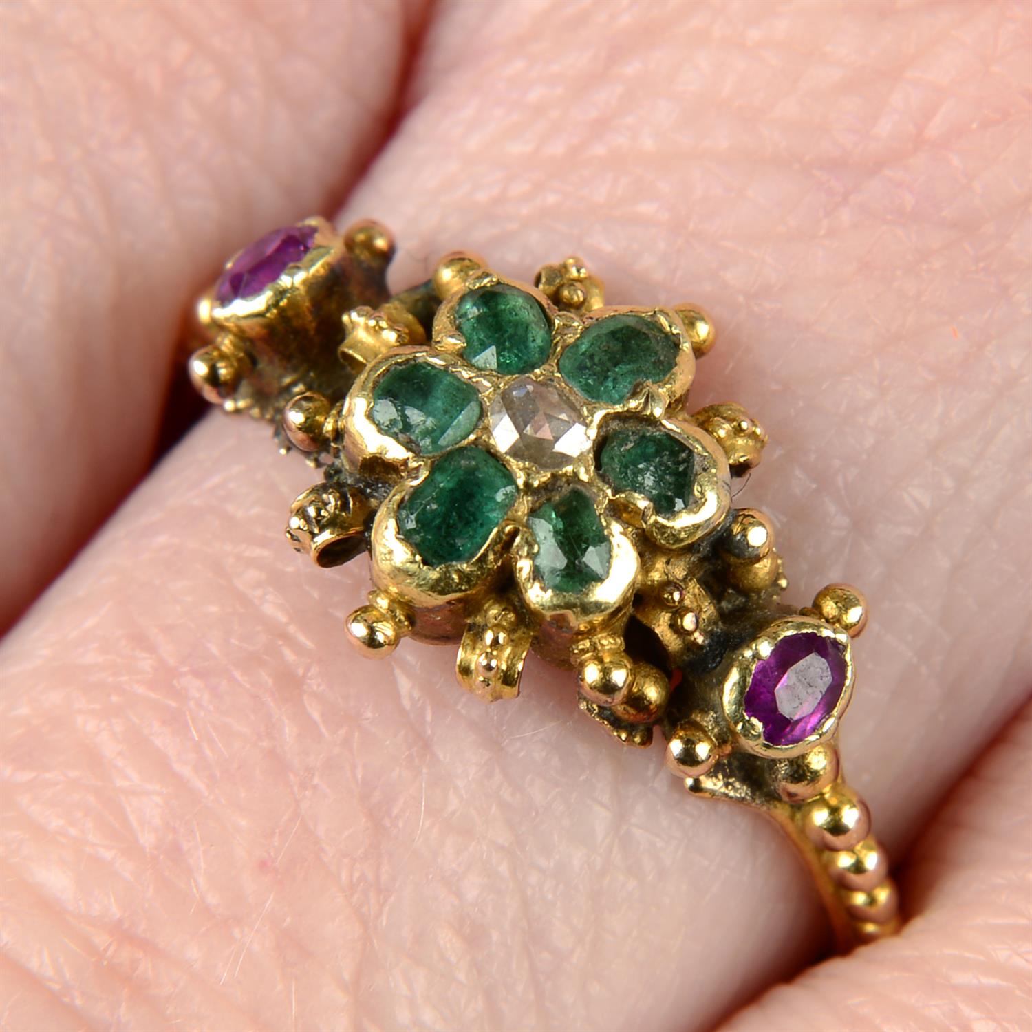 A mid Victorian gold emerald, ruby and rose-cut diamond floral ring.