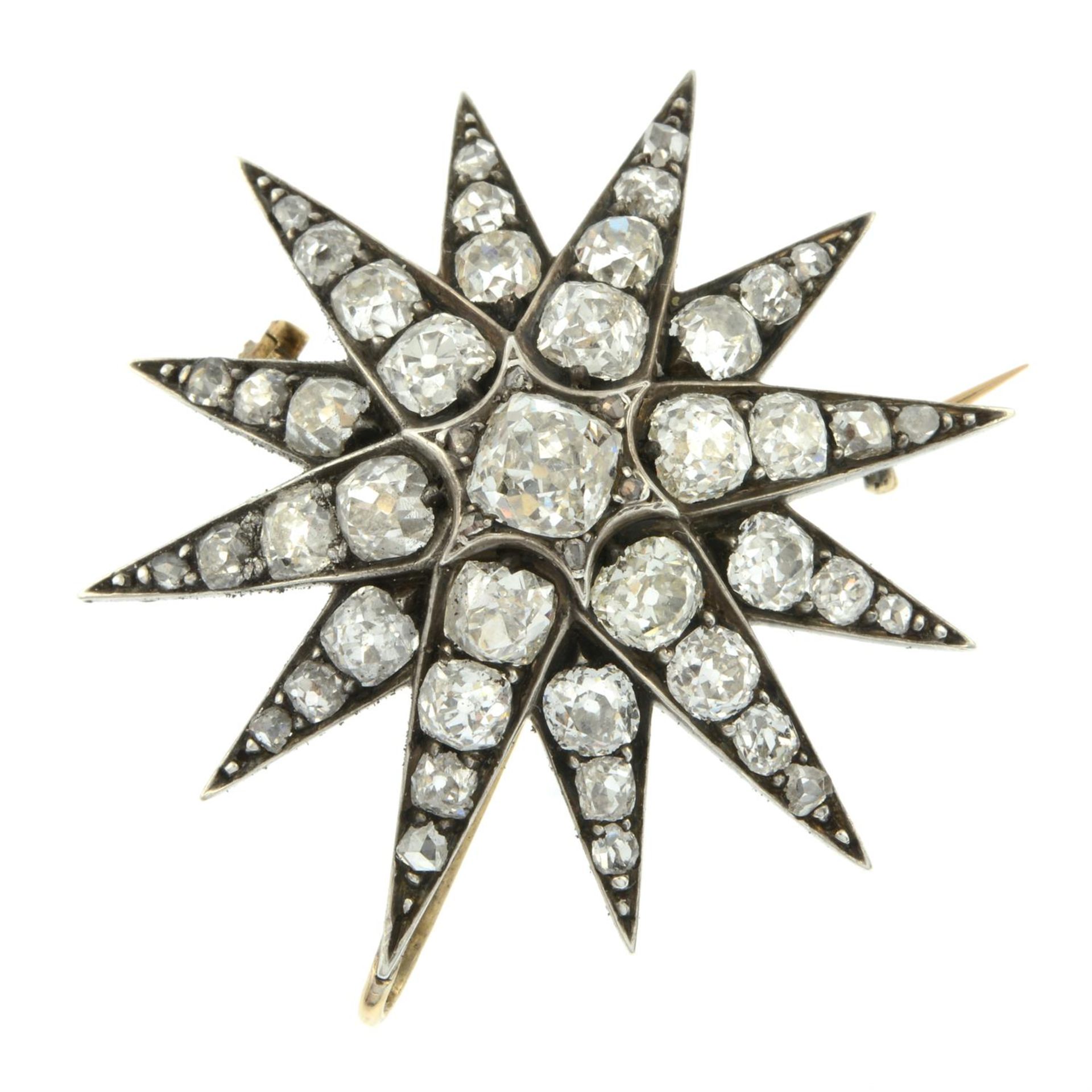 A late Victorian silver and gold old-cut diamond starburst pendant/brooch. - Image 2 of 4