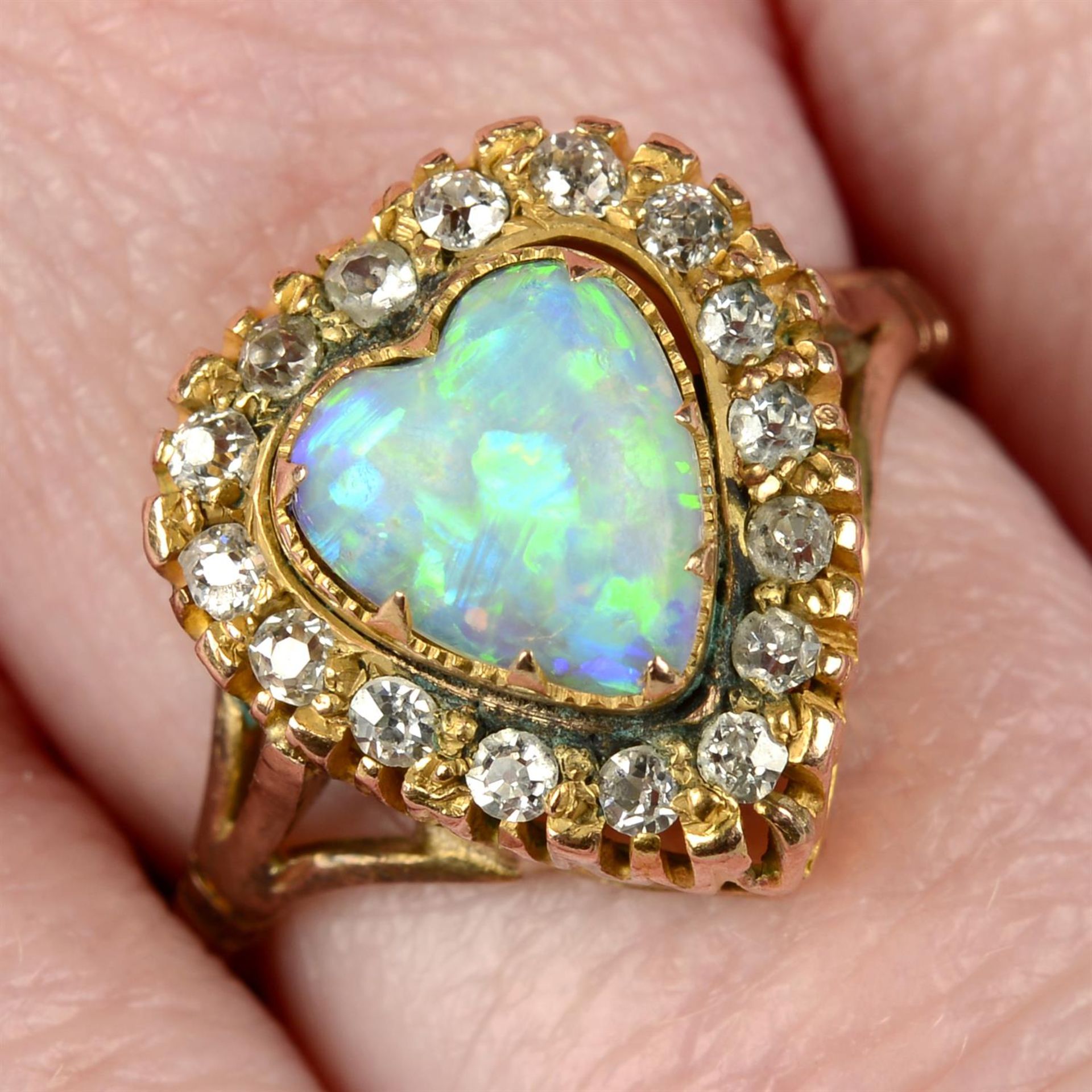 An opal heart and single-cut diamond cluster ring.