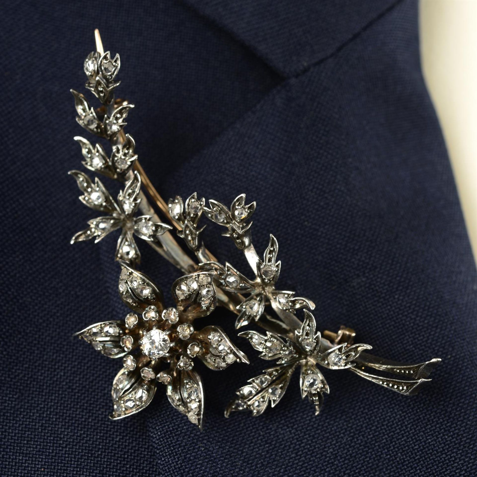 A mid 19th century silver and gold old and rose-cut diamond floral spray brooch, set en tremblant.