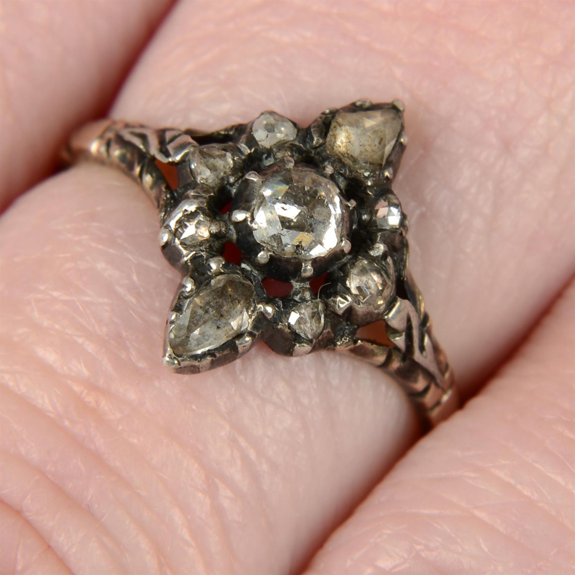 A 19th century silver and gold foil back rose-cut diamond cluster ring.