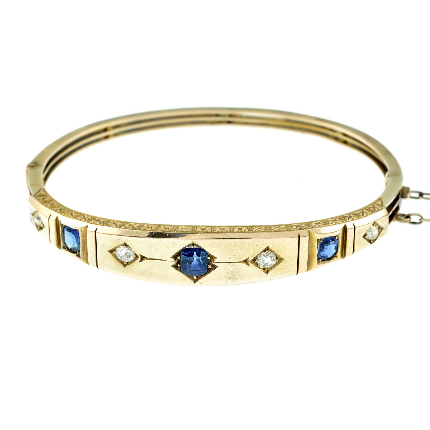 A late 19th century gold sapphire and old-cut diamond hinged bangle. - Image 2 of 3