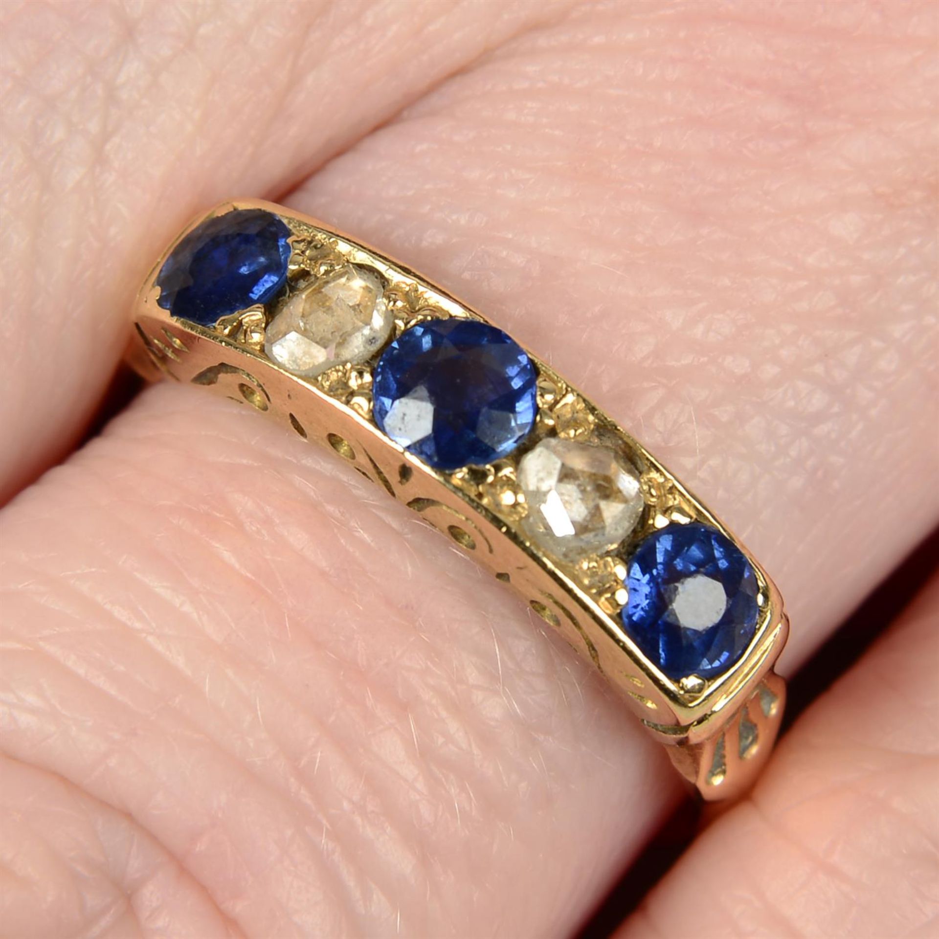 A late Victorian 18ct gold sapphire and rose-cut diamond five-stone ring.