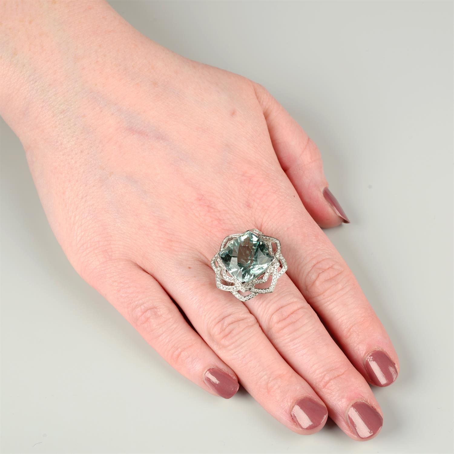 An 18ct gold aquamarine and brilliant-cut diamond floral openwork ring. - Image 5 of 5