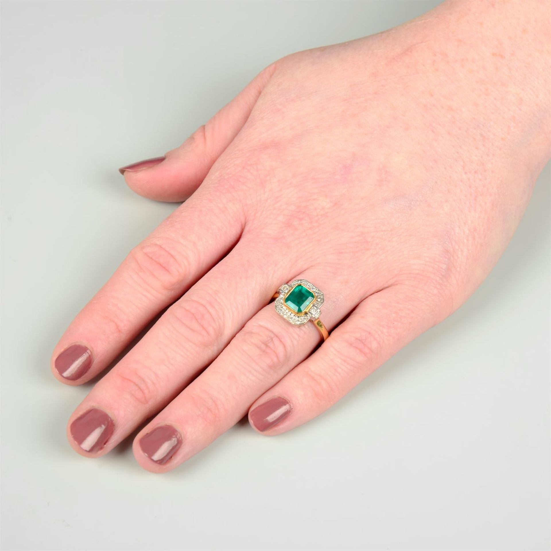 An 18ct gold emerald and vari-cut diamond dress ring. - Image 5 of 5