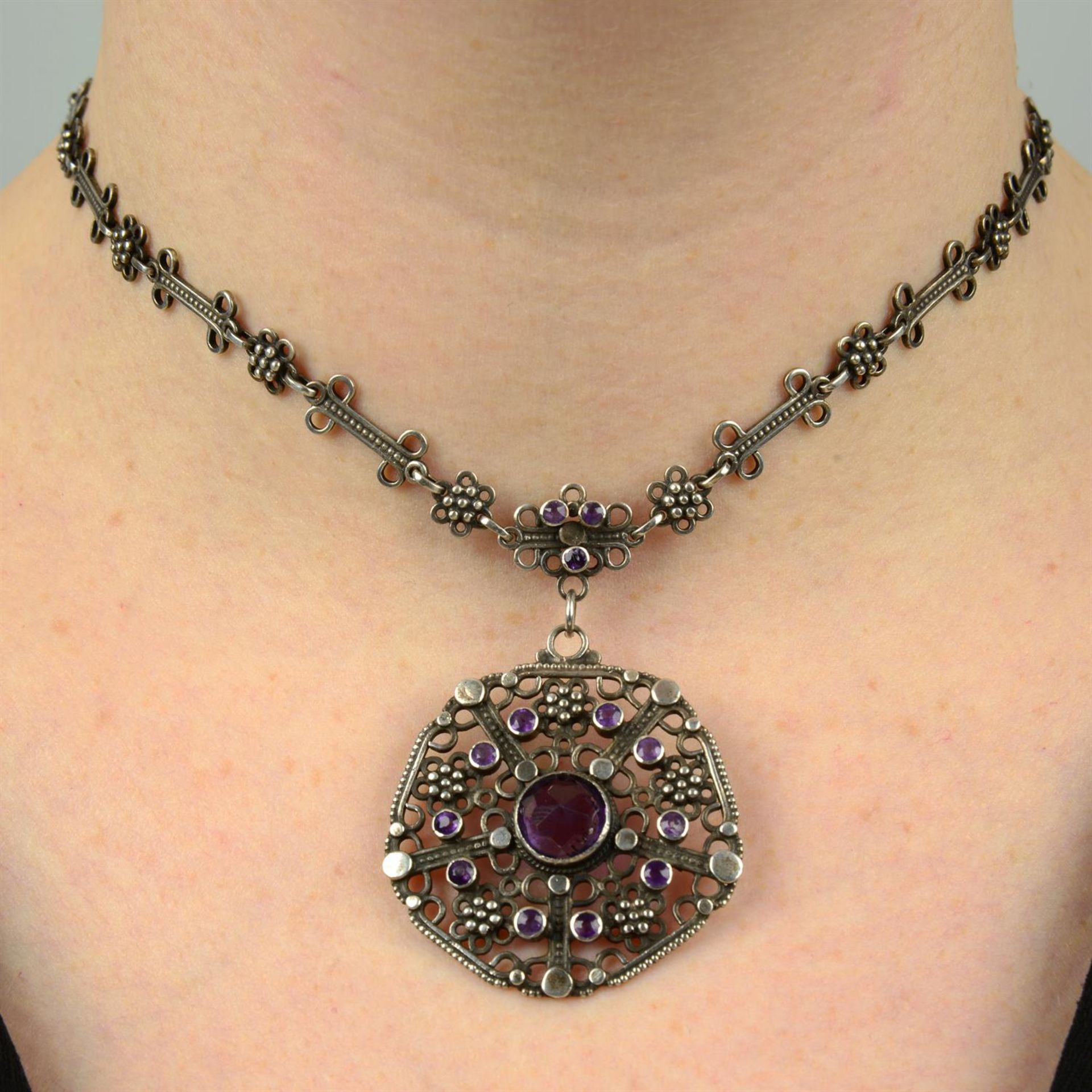 An early 20th century Arts & Crafts silver amethyst pendant on chain, by Liberty & Co.