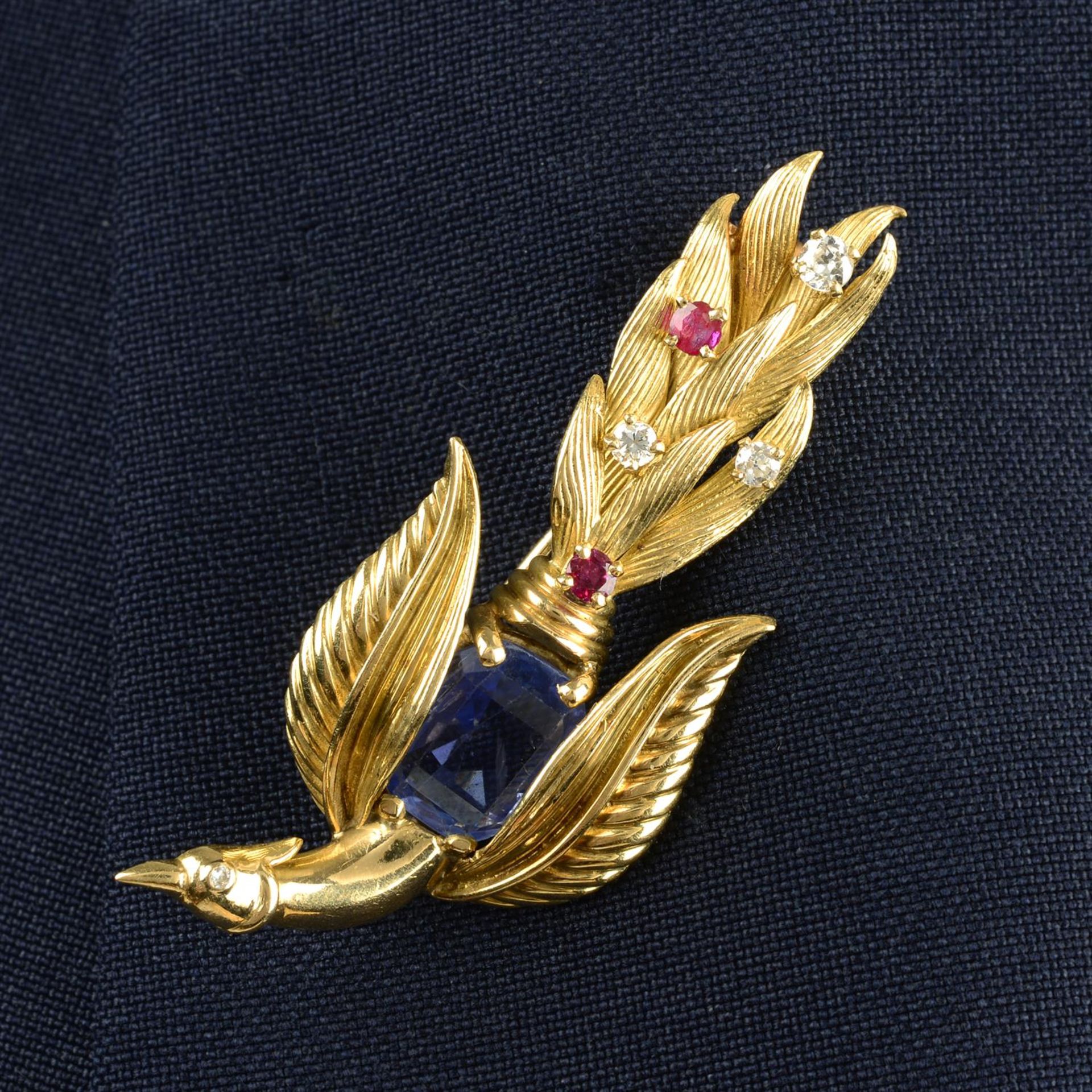 A mid 20th century 18ct gold sapphire, ruby and circular-cut diamond phoenix or bird-of-paradise