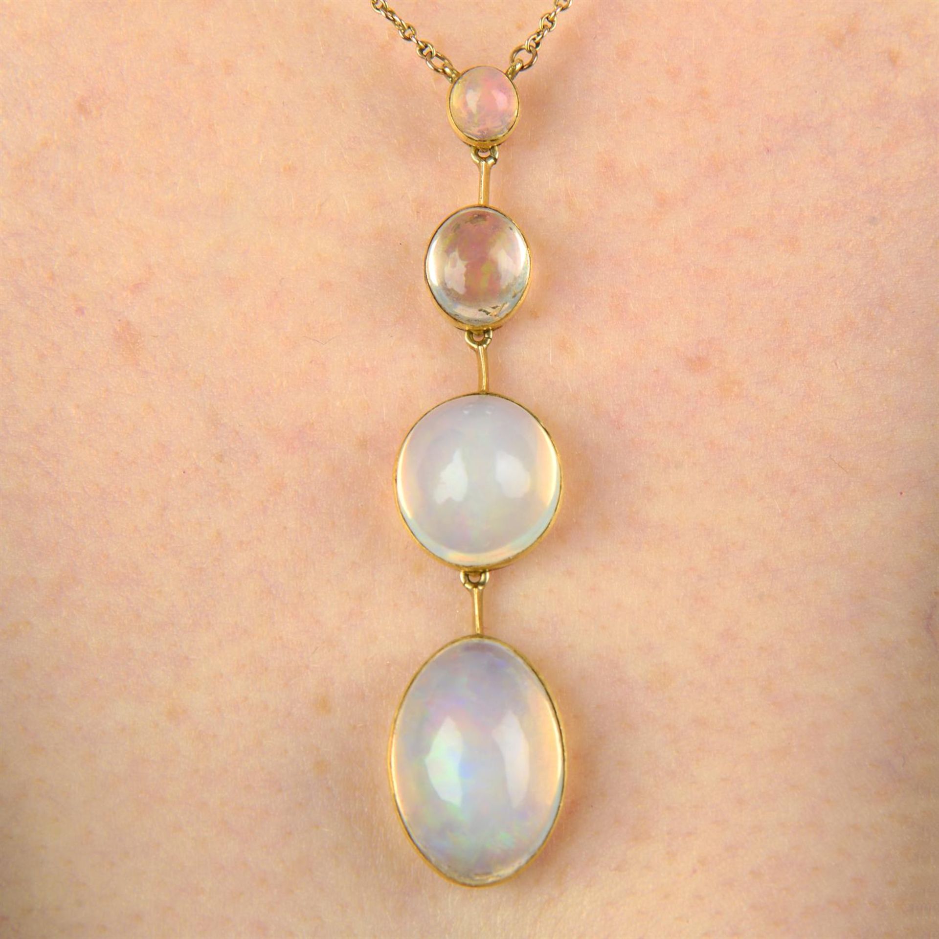 An Edwardian 15ct gold opal drop pendant, with integral chain and later clasp.