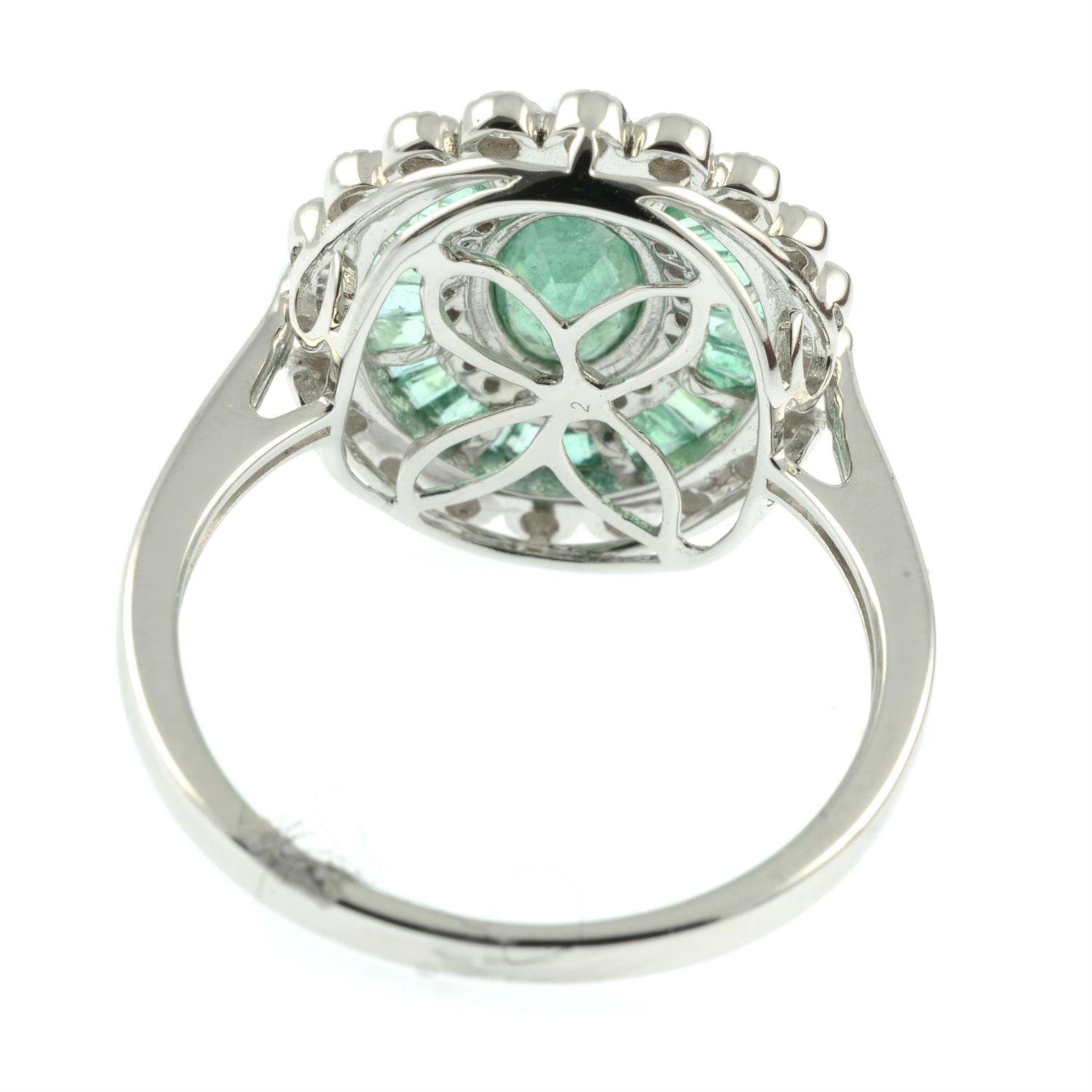 An 18ct gold emerald and diamond cluster ring. - Image 4 of 5