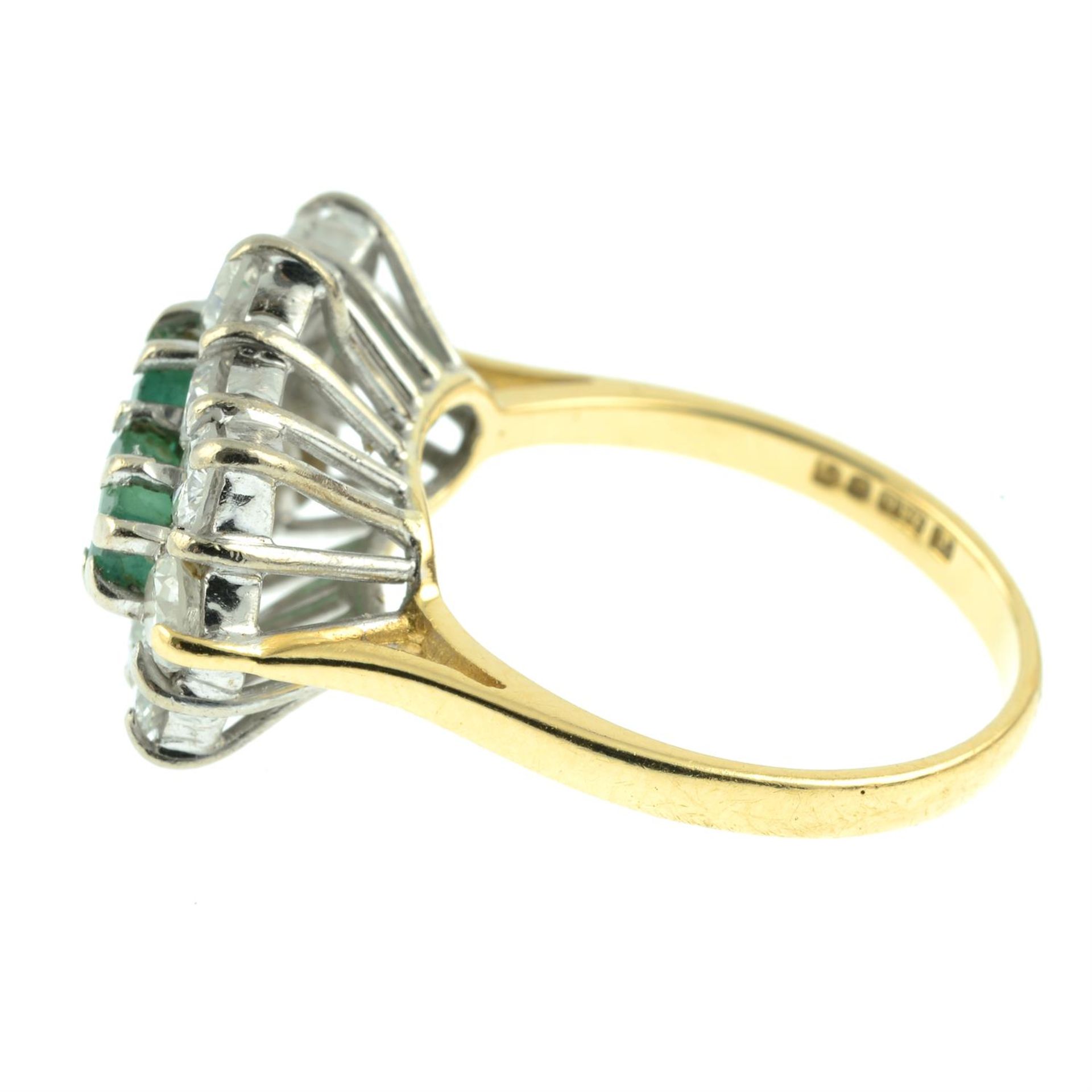 An 18ct gold emerald three-stone and brilliant-cut diamond cluster ring. - Image 3 of 5