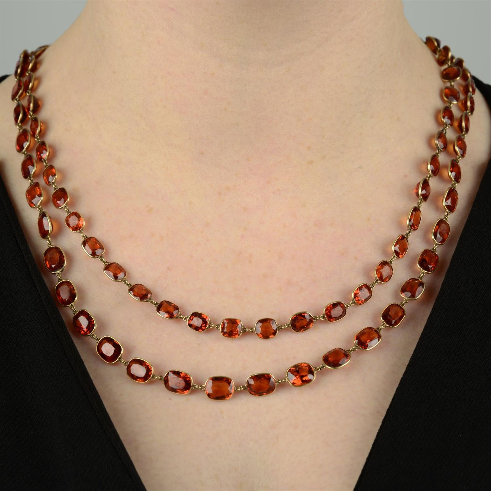 A slightly graduated hessonite garnet two-row rivieré necklace.