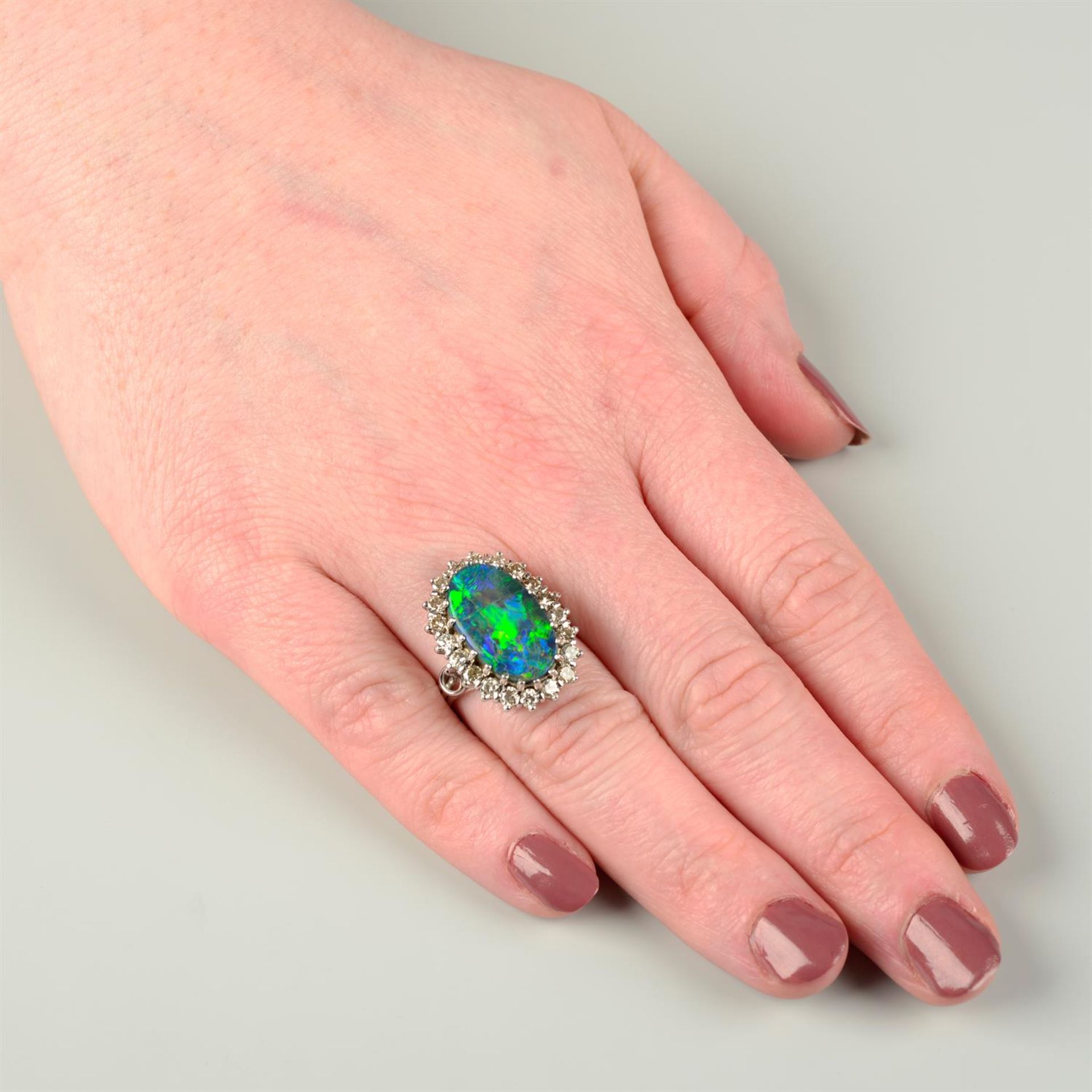 A mid 20th century platinum and 18ct gold black opal and brilliant-cut diamond cluster ring. - Image 5 of 5