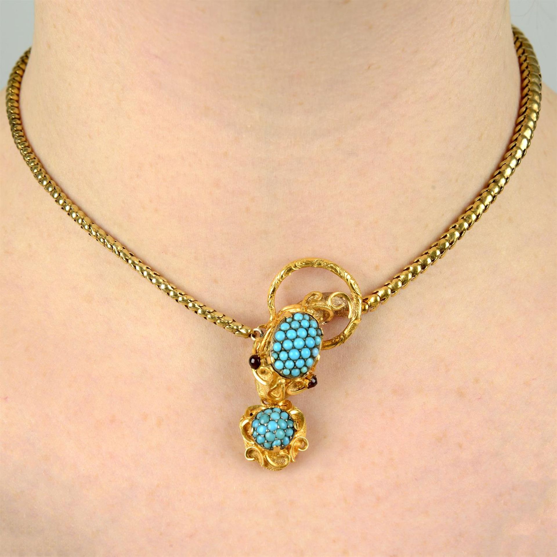 An early Victorian gold turquoise snake necklace, with similarly-designed heart locket drop and