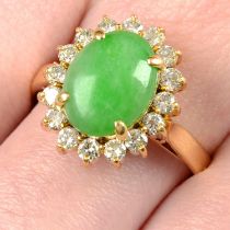A jade cabochon and brilliant-cut diamond cluster ring.