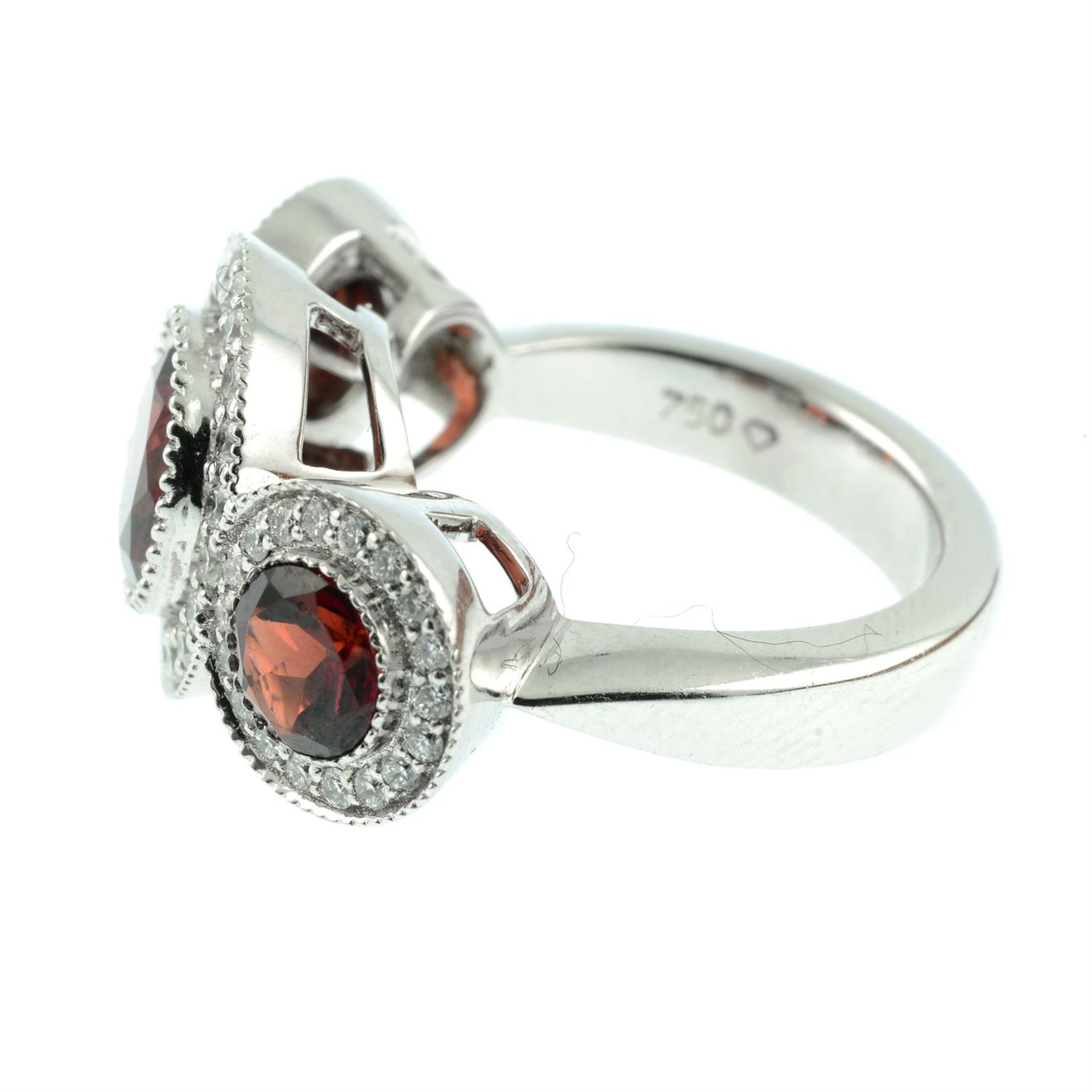 An 18ct gold garnet and brilliant-cut diamond triple cluster ring. - Image 3 of 5