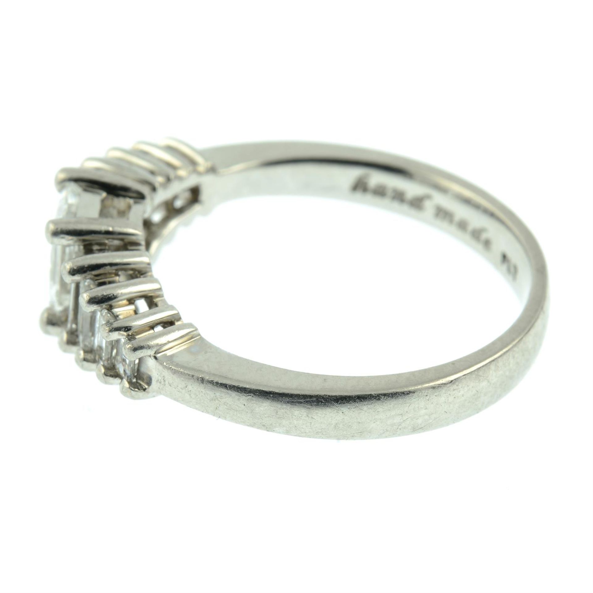 A platinum graduated baguette-cut diamond dress ring. - Image 3 of 5