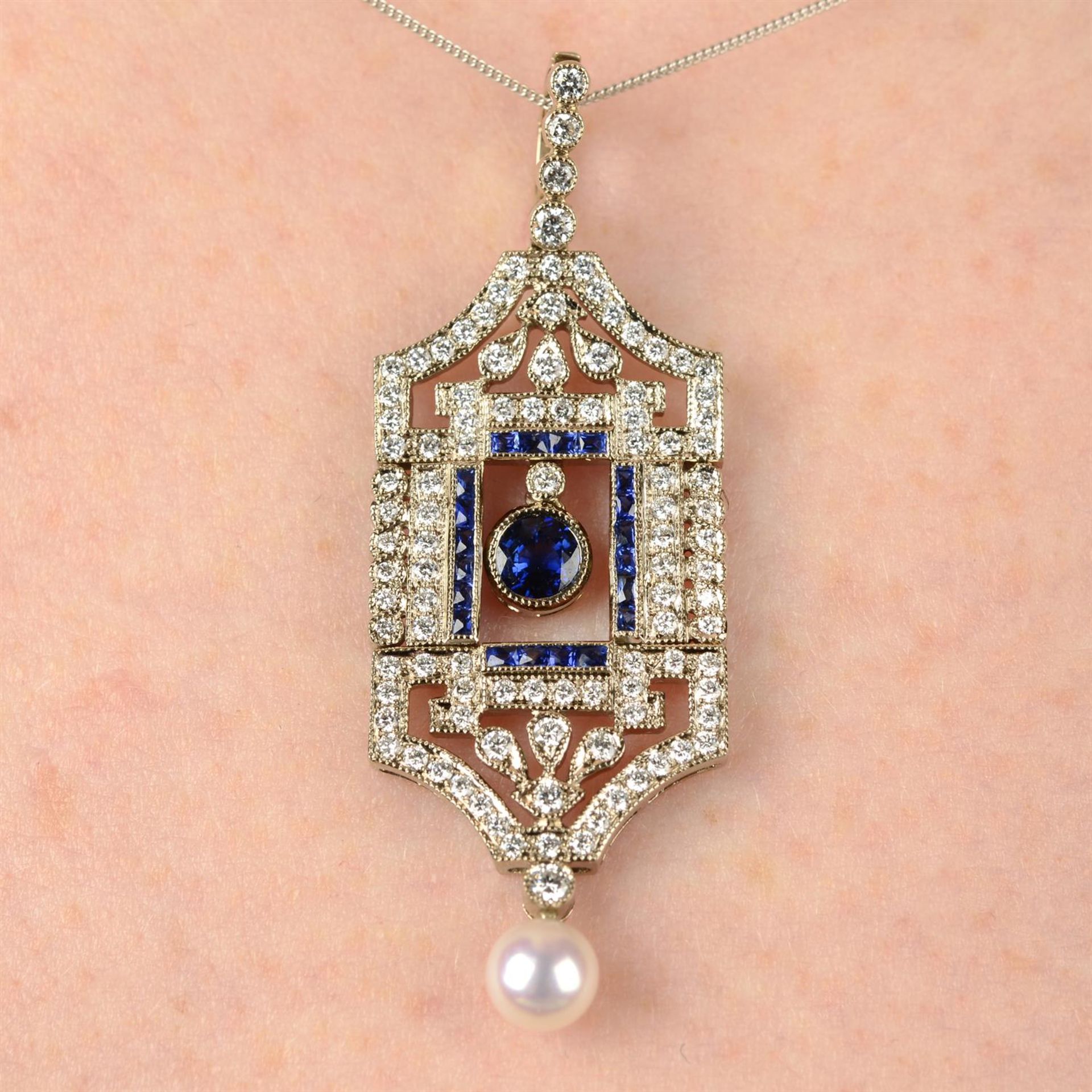 A sapphire and diamond pendant, with cultured pearl drop and 18ct gold chain.