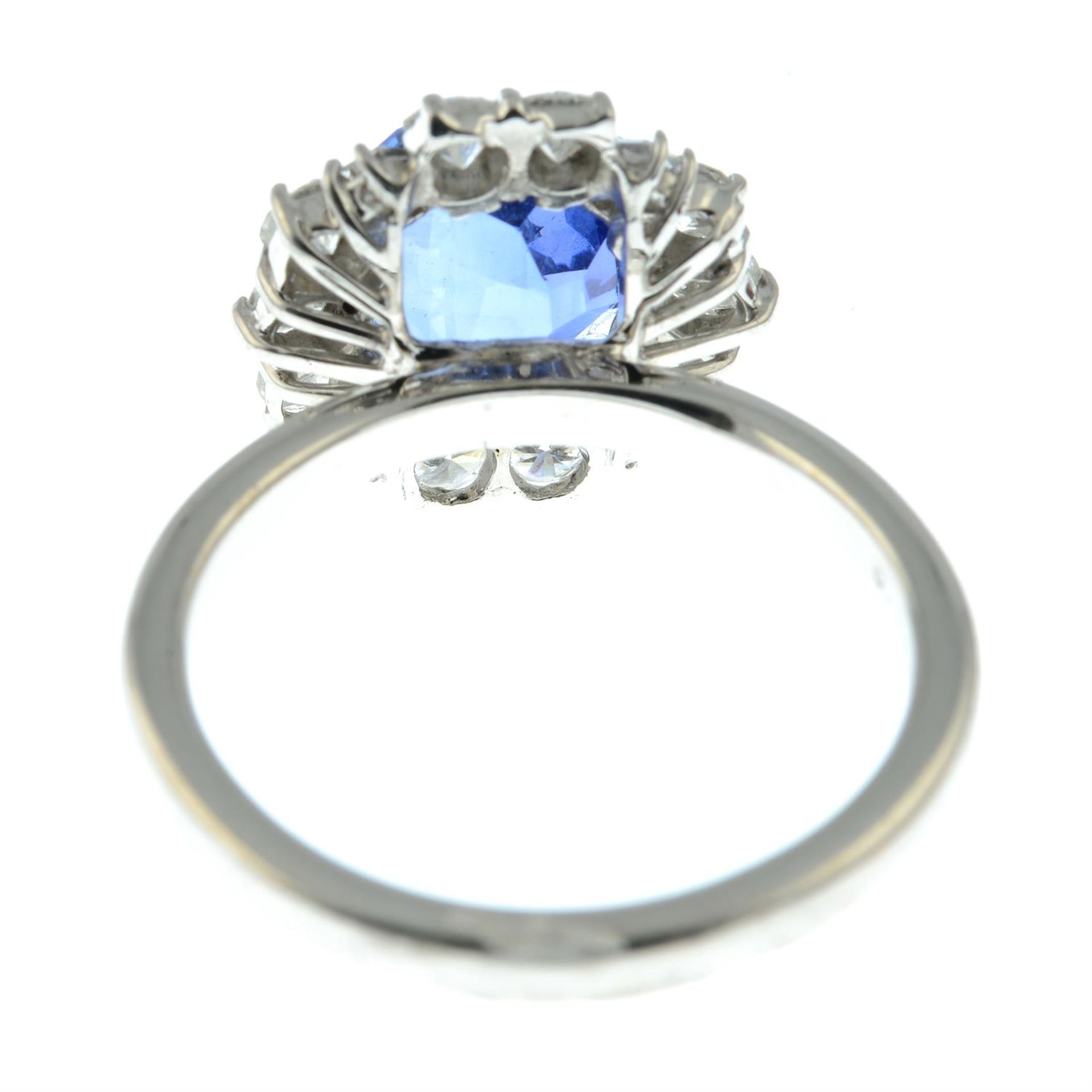 A Madagascan sapphire ring, with brilliant and baguette-cut diamond surround. - Image 4 of 5