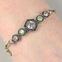An old-cut diamond bracelet, with calibre-cut sapphire and emerald surrounds.