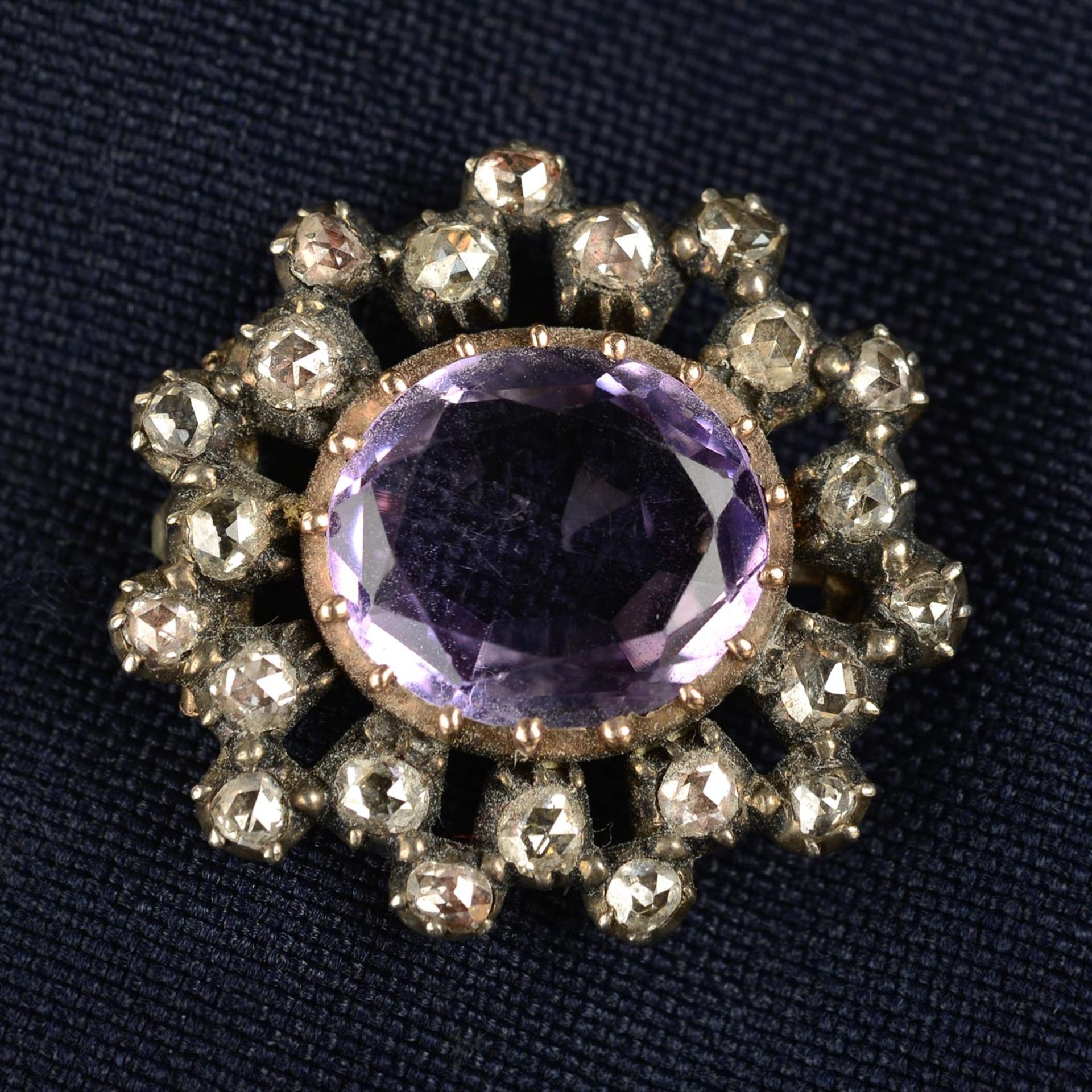An early to mid 19th century silver and gold amethyst and rose-cut diamond brooch.
