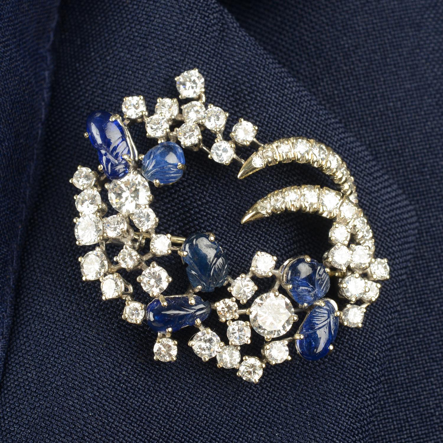 A mid 20th century 18ct gold floral carved sapphire and brilliant-cut diamond brooch.