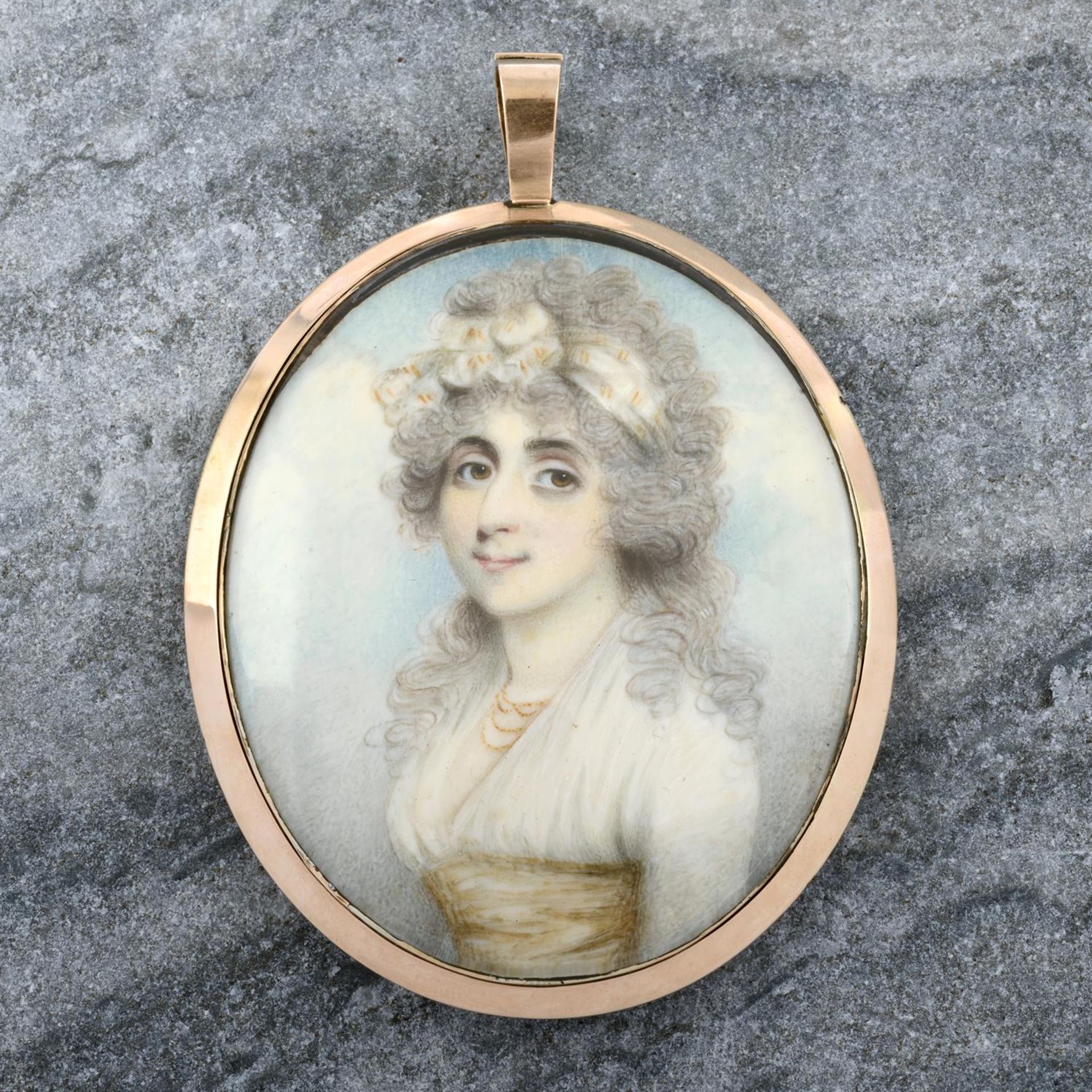 A Georgian gold mounted portrait miniature pendant, with seed pearl and hairwork reverse,