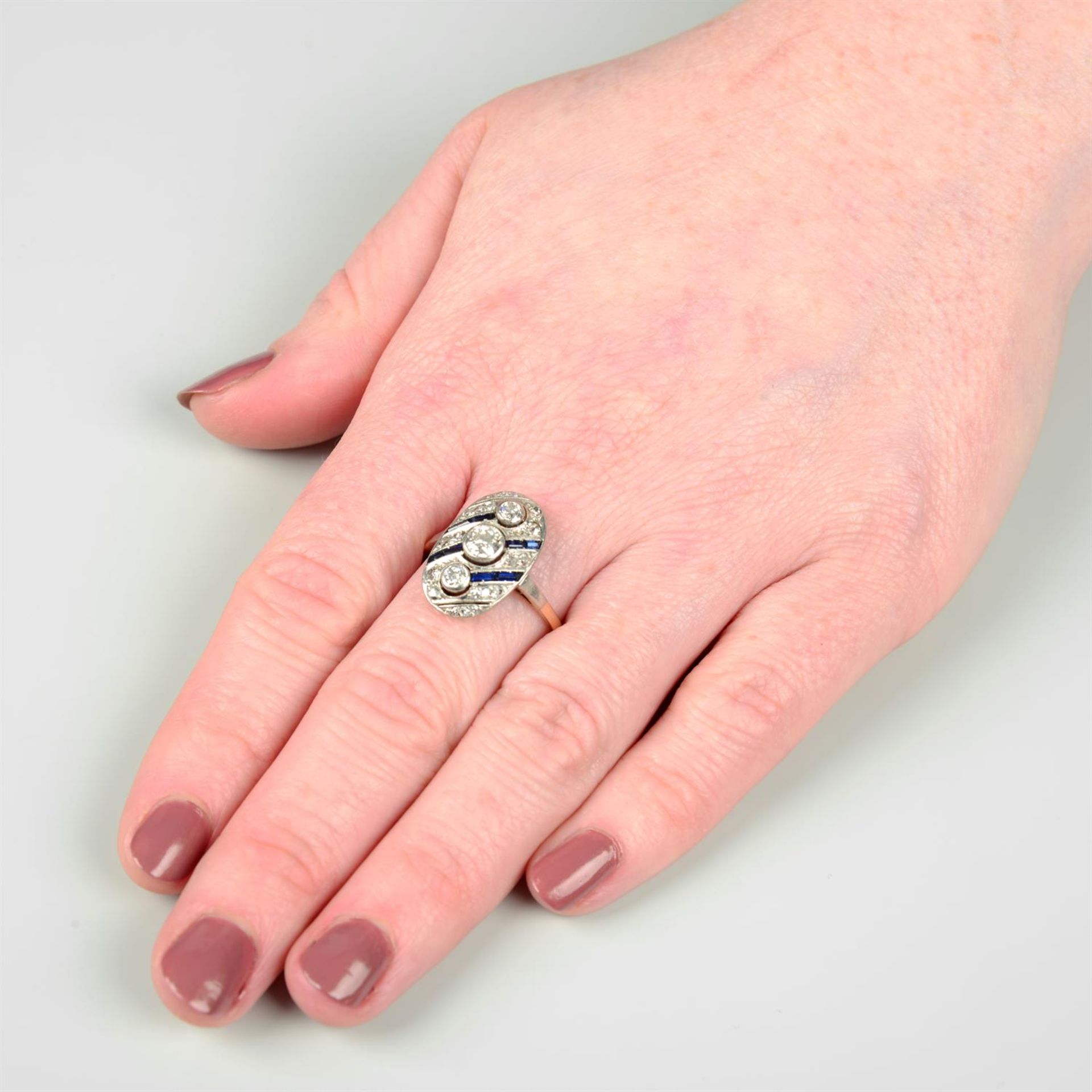 An Art Deco platinum and 14ct gold vari-cut diamond and sapphire geometric ring. - Image 5 of 5
