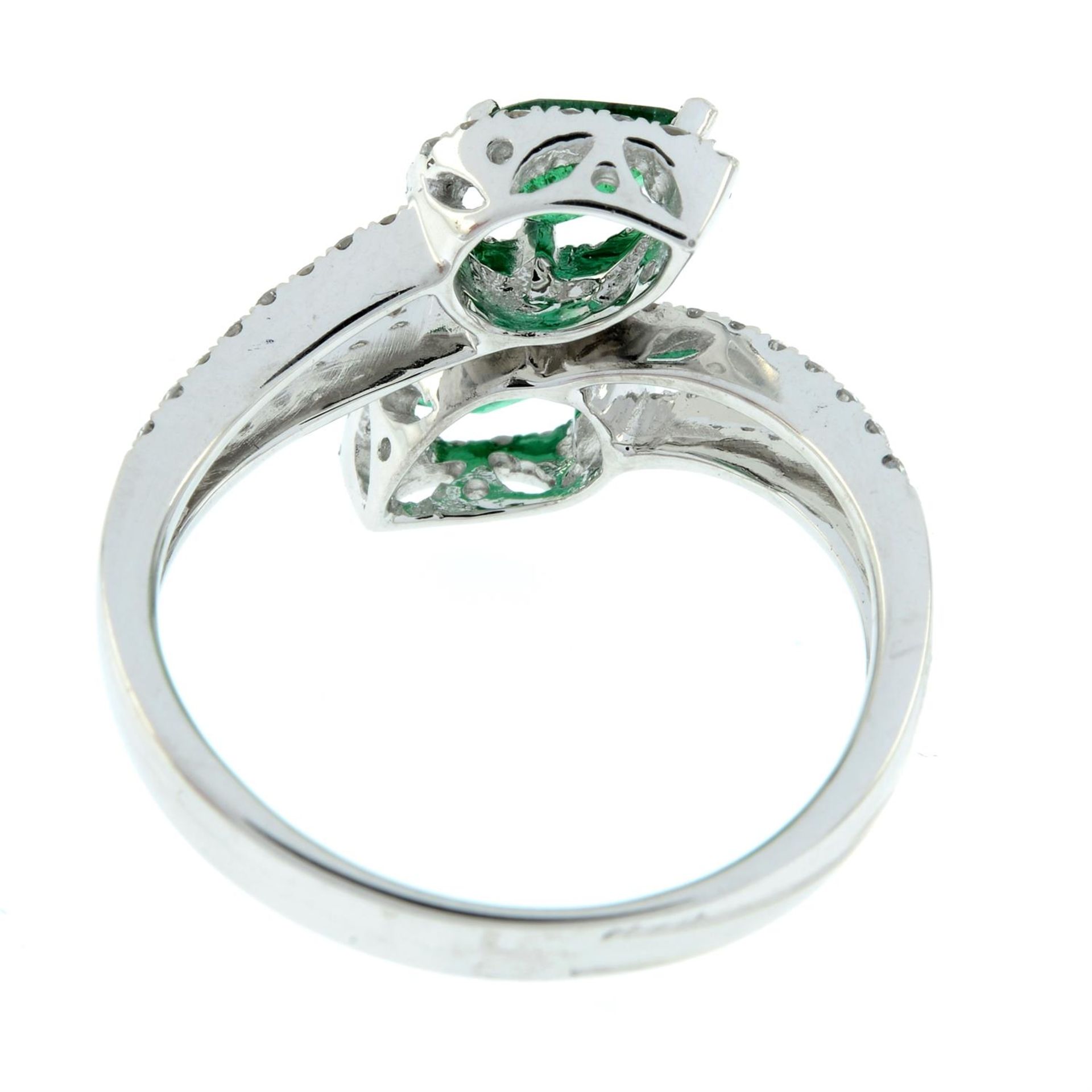 An emerald and brilliant-cut diamond crossover ring. - Image 3 of 5