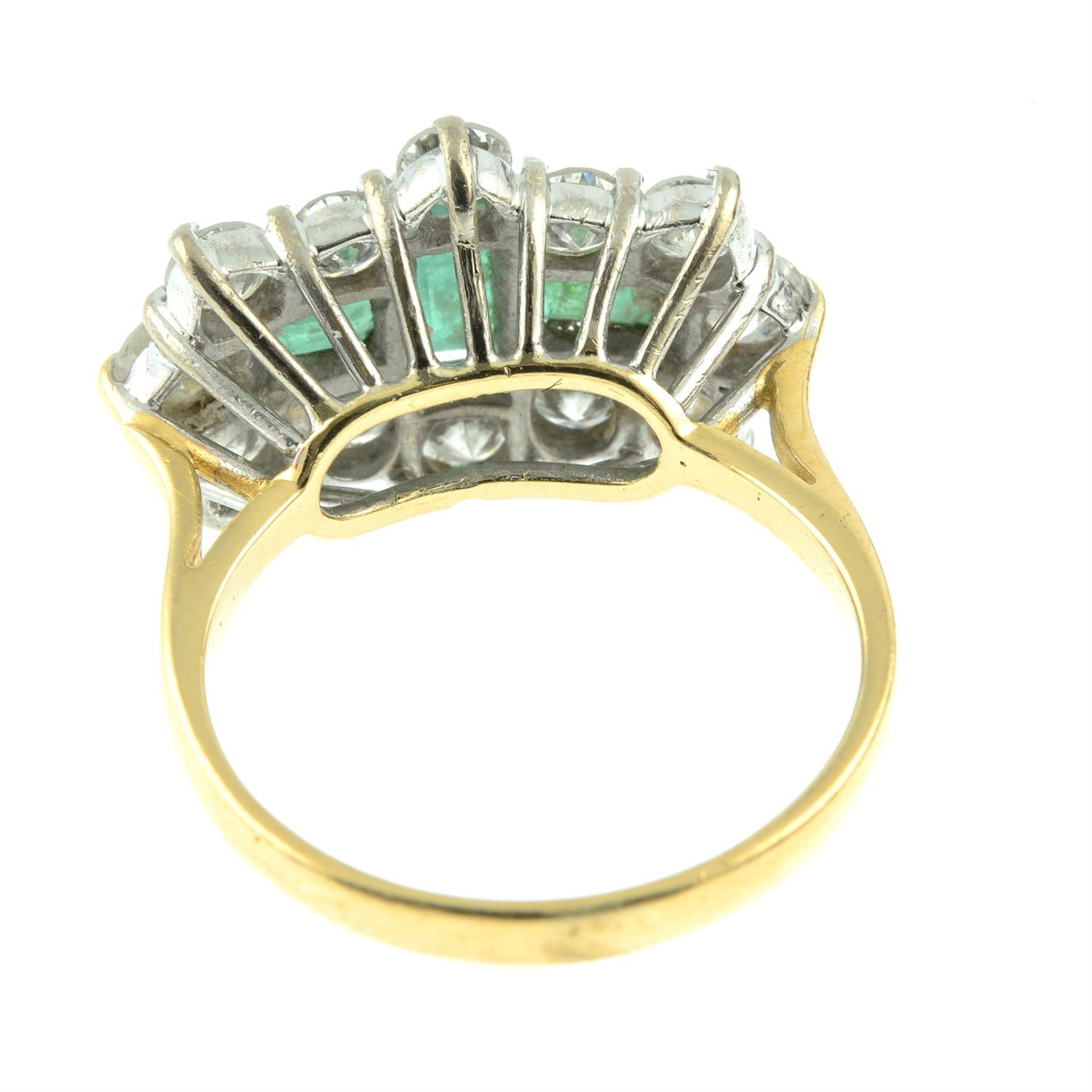 An 18ct gold emerald three-stone and brilliant-cut diamond cluster ring. - Image 4 of 5