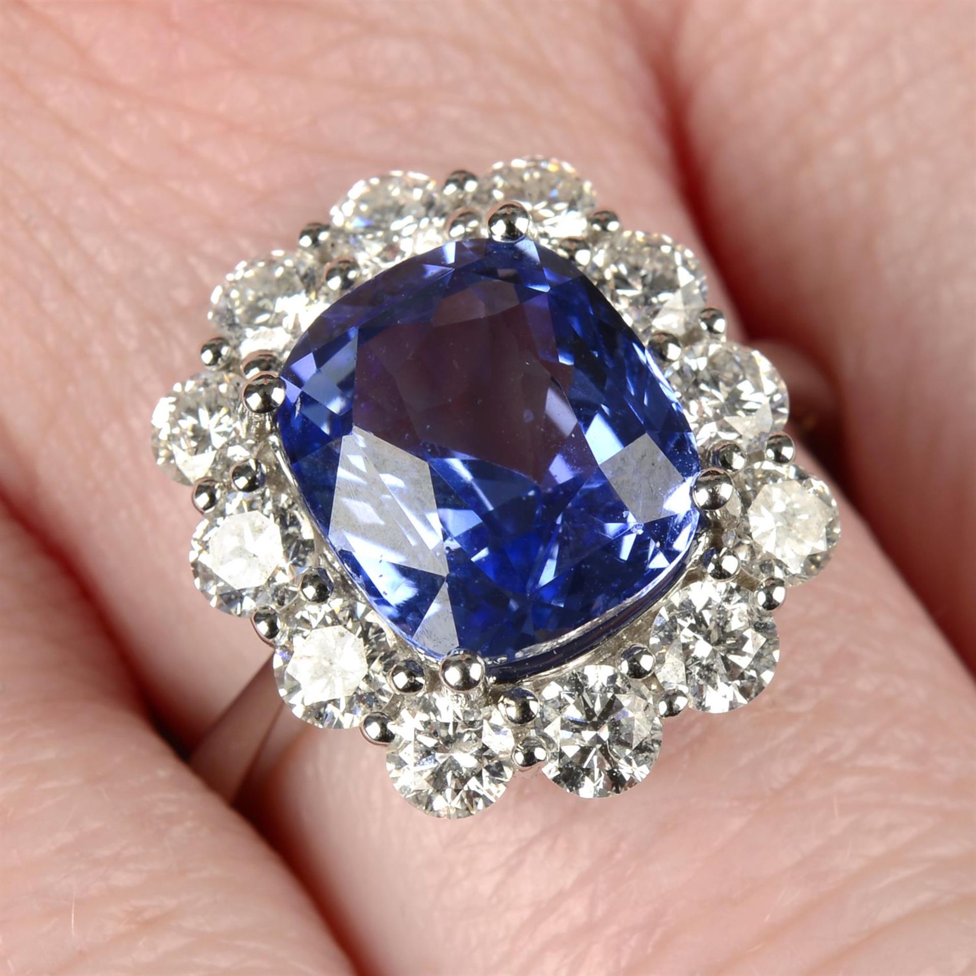 An 18ct gold sapphire and diamond cluster ring.