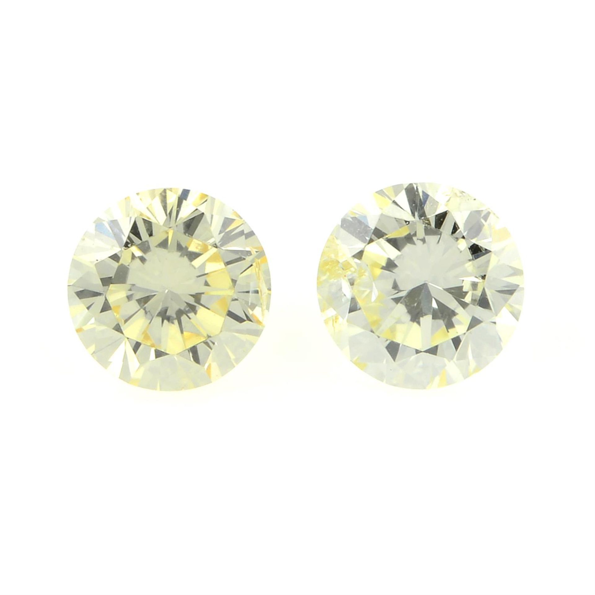 A pair of round brilliant-cut diamonds, weight 0.33ct and 0.30ct.