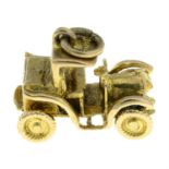 A 9ct gold articulated classic car charm.