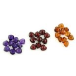 A selection of heart-shape amethysts, citrines, and red garnets, total weight 59.98cts.