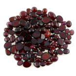 A selection of oval-shape garnet cabochons, approximate total weight 300.00cts