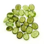 A selection of oval and pear-shape peridots, weight 48.83cts.