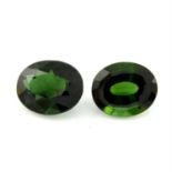 Two oval-shape green tourmalines, weight 4.97cts and 4.51cts.