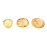 Three orangish-yellow fancy-shape topaz, total weight 12.67cts.