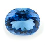 An oval-shape blue topaz, total weight 56.72cts.