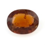 An oval-shape orange garnet, weight 9.55cts.