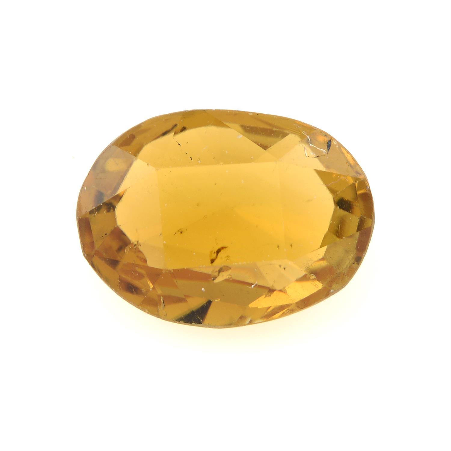 An oval-shape orange tourmaline, weight 4.23cts.