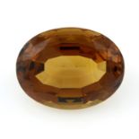 An oval-shape citrine, weight 76.51cts.