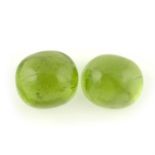 A pair of oval-shape peridot cabochons, total weight 19.65cts.