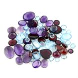 A selection of vari-shape cabochons, including blue topaz, amethysts, garnets, approximate total