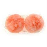 Two pieces of carved coral, depicting flowers, approximate weight 4.43cts.