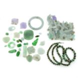 A selection of jade beads, cabochons and jewellery components, total weight approximately 254gms.