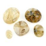 A selection of oval-shape rutilated quartz cabochons, approximate total weight 247.5cts.