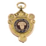 An early 20th century 9ct gold enamel medallion pendant.